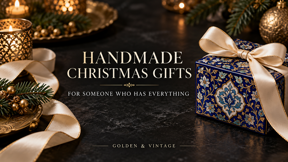 Handmade Christmas gift wrapped in ivory ribbon beside Persian-inspired blue floral patterns in Golden & Vintage black and gold styling
